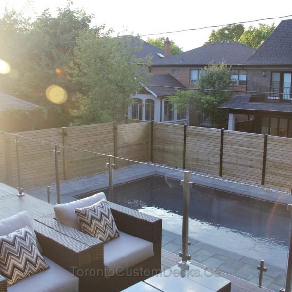 Composite deck with glass railings and fence Toronto Custom deck